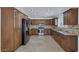 Modern kitchen with stainless steel appliances and wood cabinets at 7220 Stormson Dr, Las Vegas, NV 89145