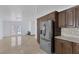 Updated kitchen with stainless steel appliances and granite counters at 7220 Stormson Dr, Las Vegas, NV 89145