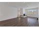 Open living room with wood floors, recessed lighting, and a cozy fireplace at 7220 Stormson Dr, Las Vegas, NV 89145