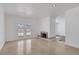 Spacious living room with a fireplace, tiled floor, and glass doors that open to the backyard at 7220 Stormson Dr, Las Vegas, NV 89145