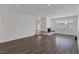 Bright living room with hardwood floors and a built-in fireplace at 7220 Stormson Dr, Las Vegas, NV 89145