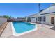 Sparkling blue kidney-shaped pool in backyard at 7220 Stormson Dr, Las Vegas, NV 89145