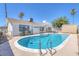 Relaxing kidney shaped pool with ample patio space at 7220 Stormson Dr, Las Vegas, NV 89145