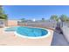 Sparkling backyard pool with ample concrete decking, block wall, and sunny exposure at 7220 Stormson Dr, Las Vegas, NV 89145