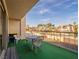 Cozy balcony furnished with a table and chairs, offering a view of the neighborhood at 725 N Royal Crest Cir # 215, Las Vegas, NV 89169