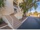 Apartment building featuring well-maintained landscaping and easy access to upper floors via stairs at 725 N Royal Crest Cir # 215, Las Vegas, NV 89169