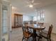 The dining room features a wooden table set, china cabinet and views of the living room at 725 N Royal Crest Cir # 215, Las Vegas, NV 89169
