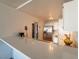 Well-lit kitchen with stainless steel fridge and a large countertop with sink at 725 N Royal Crest Cir # 215, Las Vegas, NV 89169
