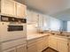 Bright kitchen with oven and view to the living room at 725 N Royal Crest Cir # 215, Las Vegas, NV 89169