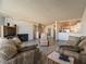 Living room showcasing fireplace, furnishings, and an open layout to the kitchen at 725 N Royal Crest Cir # 215, Las Vegas, NV 89169