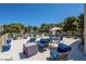 Large rooftop terrace with multiple seating areas, lounge furniture, and manicured landscaping at 725 N Royal Crest Cir # 215, Las Vegas, NV 89169