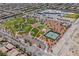 Aerial view of community park with playground, tennis courts, and open green spaces at 7611 Phoenix Peak St, Las Vegas, NV 89166
