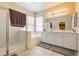 Main bathroom with a shower, bathtub, and double vanity at 7611 Phoenix Peak St, Las Vegas, NV 89166