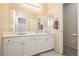 Clean bathroom with double vanity and mirrored medicine cabinet at 7611 Phoenix Peak St, Las Vegas, NV 89166