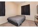 Cozy bedroom with a double bed and neutral color palette at 7611 Phoenix Peak St, Las Vegas, NV 89166