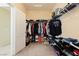 Large walk-in closet with custom shelving and hanging rods at 7611 Phoenix Peak St, Las Vegas, NV 89166