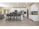 Modern kitchen with white cabinets, granite countertops, and stainless steel appliances at 7611 Phoenix Peak St, Las Vegas, NV 89166
