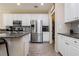 Modern kitchen with stainless steel appliances and granite countertops at 7611 Phoenix Peak St, Las Vegas, NV 89166