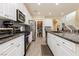 Modern kitchen with white cabinets and large island at 7611 Phoenix Peak St, Las Vegas, NV 89166