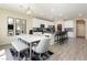 Open concept kitchen with island and white shaker cabinets at 7611 Phoenix Peak St, Las Vegas, NV 89166