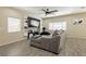 Living room with sectional sofa and large TV at 7611 Phoenix Peak St, Las Vegas, NV 89166