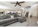 Spacious living room with large sectional sofa and hardwood floors at 7611 Phoenix Peak St, Las Vegas, NV 89166