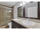 Bathroom features dual sinks, granite counters, tile floors, and glass enclosed shower at 7950 W Flamingo Rd # 2056, Las Vegas, NV 89147