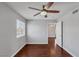 Bedroom with hardwood floors, ceiling fan, and en-suite bathroom at 7950 W Flamingo Rd # 2056, Las Vegas, NV 89147
