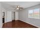 Bedroom features hardwood floors, ceiling fan, window, and closet at 7950 W Flamingo Rd # 2056, Las Vegas, NV 89147