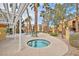 Community hot tub and pool with lush palm trees at 7950 W Flamingo Rd # 2056, Las Vegas, NV 89147