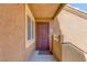 Welcoming condo entrance featuring secure metal door, neutral paint, and unit number 2056 at 7950 W Flamingo Rd # 2056, Las Vegas, NV 89147