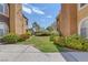 Landscaped view of community buildings with sidewalk and green space at 7950 W Flamingo Rd # 2056, Las Vegas, NV 89147