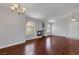 Spacious living room with fireplace, hardwood floors, and arched windows providing natural light at 7950 W Flamingo Rd # 2056, Las Vegas, NV 89147