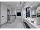 Modern bathroom with double sinks, contemporary fixtures, and a glass-enclosed shower at 1 Boulderback Dr, Henderson, NV 89012