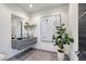 Stylish powder room featuring a modern floating vanity, sleek fixtures, and elegant decorative touches at 1 Boulderback Dr, Henderson, NV 89012
