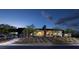Contemporary home exterior with meticulously manicured landscaping, lit walkways, and modern design at 1 Boulderback Dr, Henderson, NV 89012