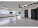 Spacious and well-lit garage with epoxy floors, offering ample space for parking and storage at 1 Boulderback Dr, Henderson, NV 89012