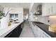 Galley kitchen with sleek cabinets and an island at 1 Boulderback Dr, Henderson, NV 89012