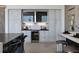 Modern kitchen with a wine cooler and center island with seating at 1 Boulderback Dr, Henderson, NV 89012