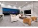 Elegant living room with a fireplace, comfortable seating, and breathtaking city skyline views at night at 1 Boulderback Dr, Henderson, NV 89012