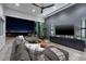 Modern living room with a large sectional couch and a view of the city at 1 Boulderback Dr, Henderson, NV 89012