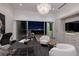 Modern office with a large desk, comfortable seating, and a view of the city lights at night at 1 Boulderback Dr, Henderson, NV 89012