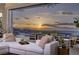 Elegant outdoor space with sunset views, comfortable seating, and seamless indoor-outdoor flow at 1 Boulderback Dr, Henderson, NV 89012