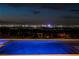 Stunning backyard pool with captivating views of the Las Vegas skyline at night at 1 Boulderback Dr, Henderson, NV 89012
