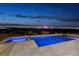 Night view of modern pool and spa at 1 Boulderback Dr, Henderson, NV 89012