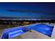 Luxury pool and spa showcasing serene city views with elegant stone and modern design at 1 Boulderback Dr, Henderson, NV 89012