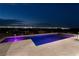 Night view of modern pool and spa at 1 Boulderback Dr, Henderson, NV 89012