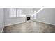 Bright living room with fireplace and wood-look floors at 1701 E Katie Ave # 10, Las Vegas, NV 89119