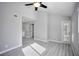 Bright bedroom with wood-look floors, vaulted ceiling and sliding glass door at 1701 E Katie Ave # 32, Las Vegas, NV 89119
