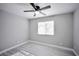 Well-lit bedroom with ceiling fan and wood flooring at 1701 E Katie Ave # 32, Las Vegas, NV 89119